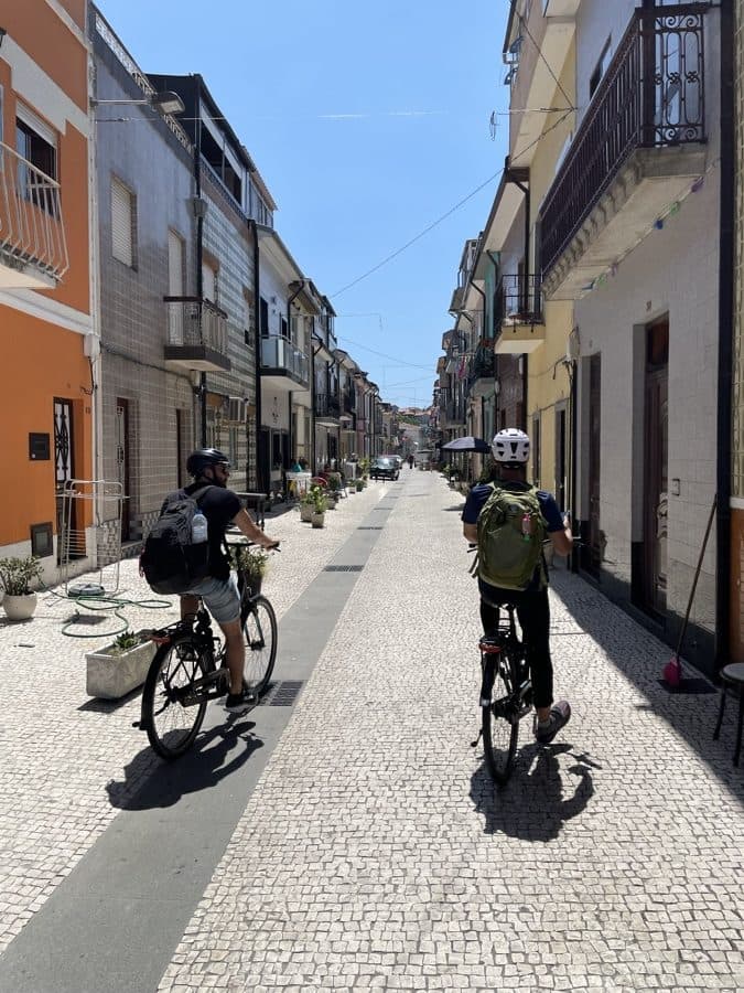 Cycling a narrow cobbled street somewhere in Europe